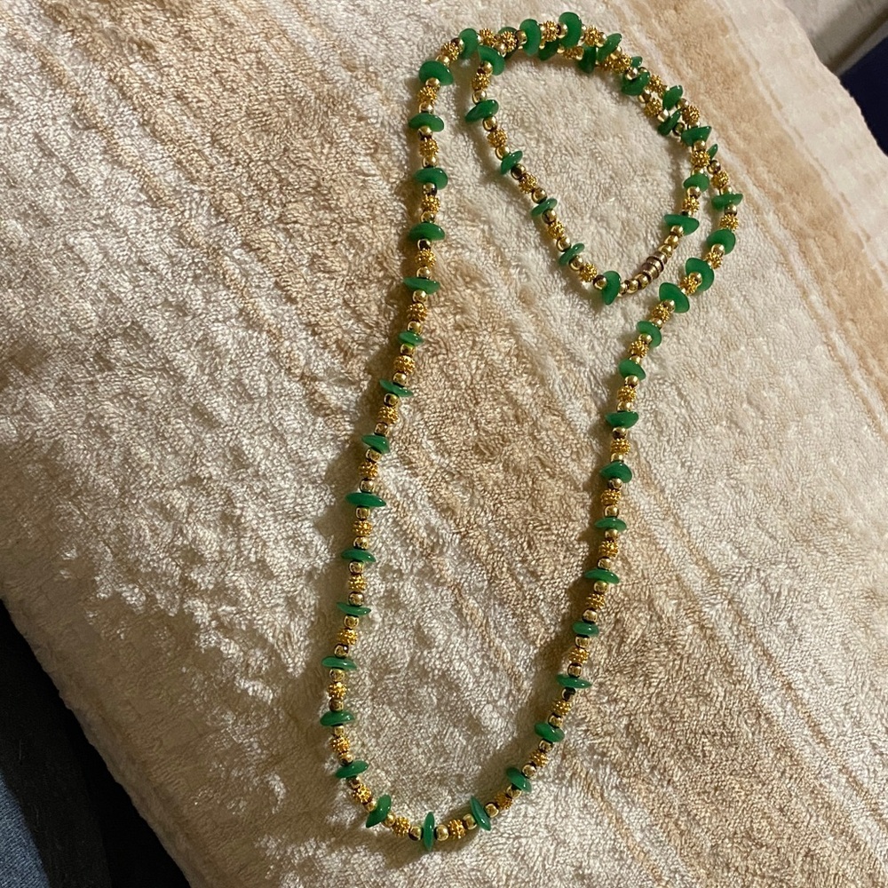 Green jade necklace chips with gold tone spacer beads.   Beaded Necklace